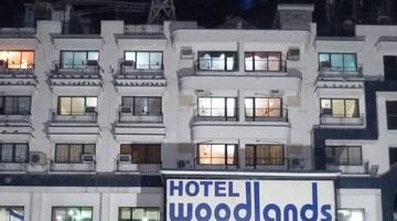 hotel woodlands, vapi
